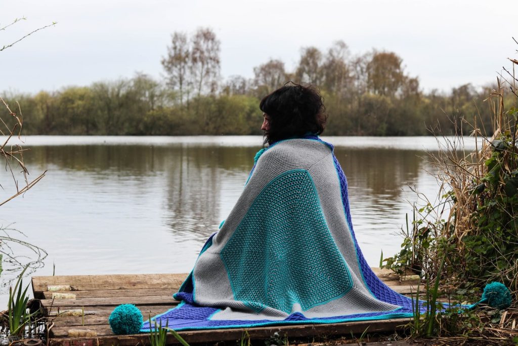 Crochet blanket with giant pompoms by Anna Nikipirowicz