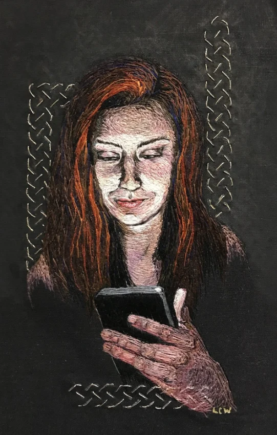 Woman on her phone, hand embroidered by Lesley Wood