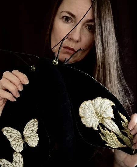 Larysa Bernhardt holding one of her sculptured moths