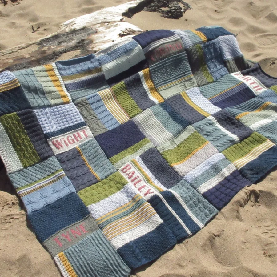 amazing Knitted blanket designed and created by graduate Lynn Hall, displayed on the beach