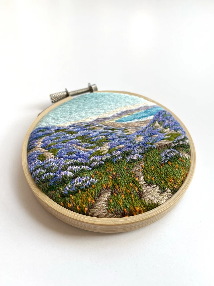 Embroidery hoop art by Cassandra Dias, Purple Florals by the Sea Front