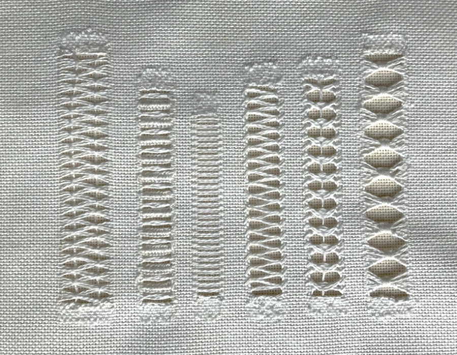 Detailed hand embroidery panel showing pulled thread stitchwork, by SST Skill Stage 2 graduate Elaine Fraser